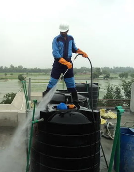 Water tank cleaning and sanitization service in Karachi by Nest Fumigation Services